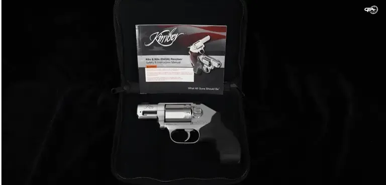 Photo of a Kimber K6S in a case, with Kimber documentation