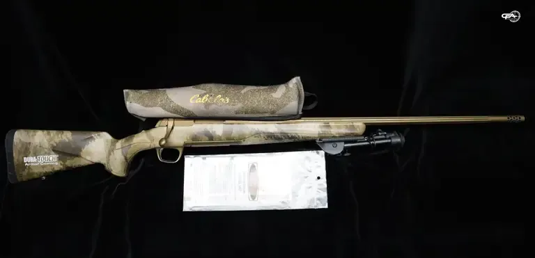 Picture of a Browning X-Bolt with some documentation