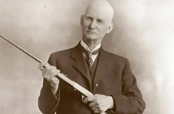 John Browning with a shotgun