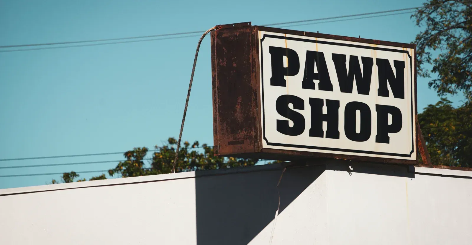 Pawn shop sign on top of building