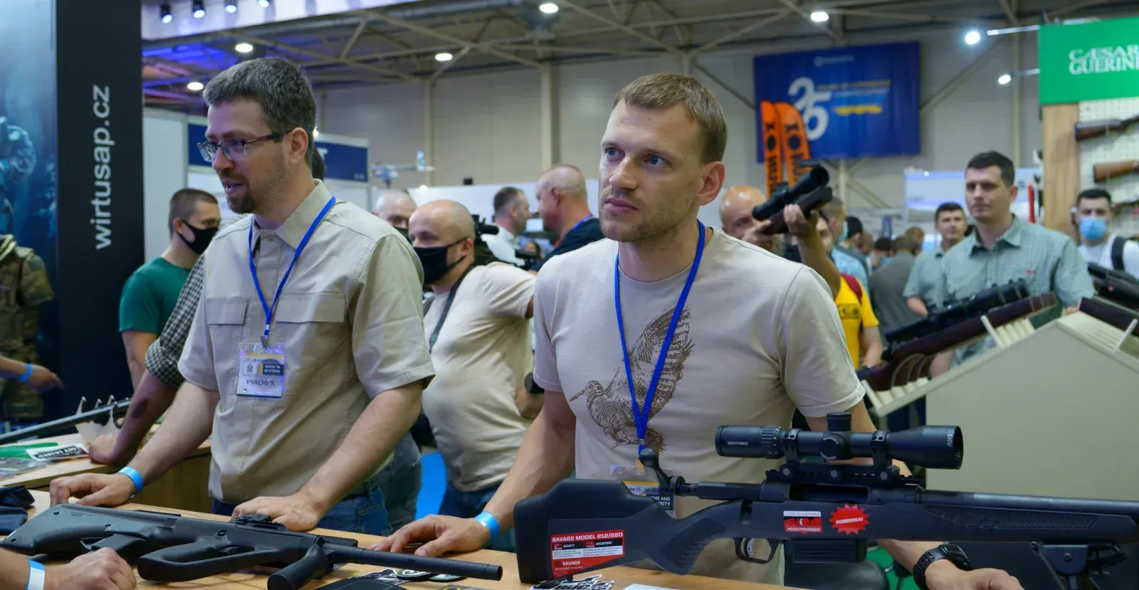 People looking at guns