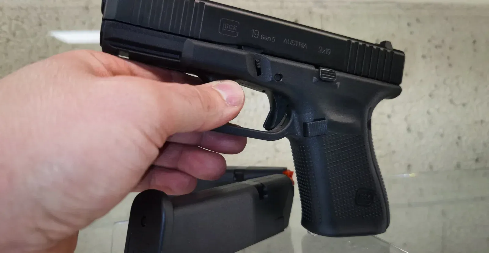 Person holding an unloaded Glock 19 Gen 5