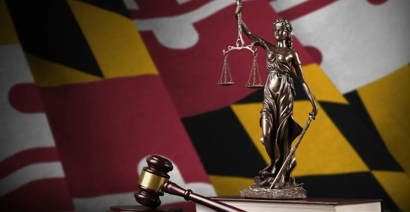 Maryland State Flag with gavel and scales of justice