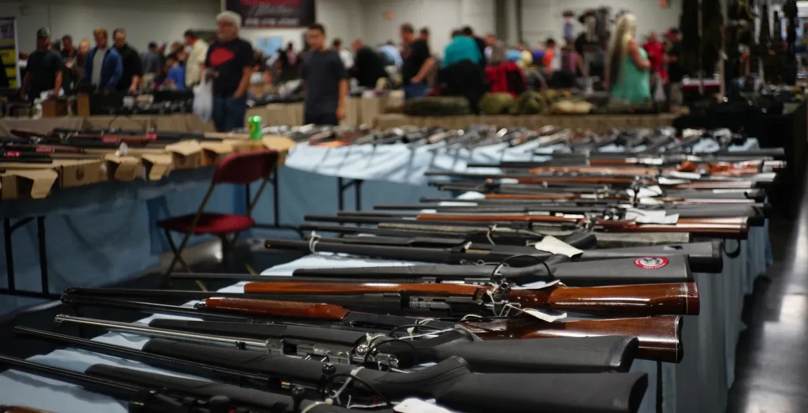 Several guns laying on table