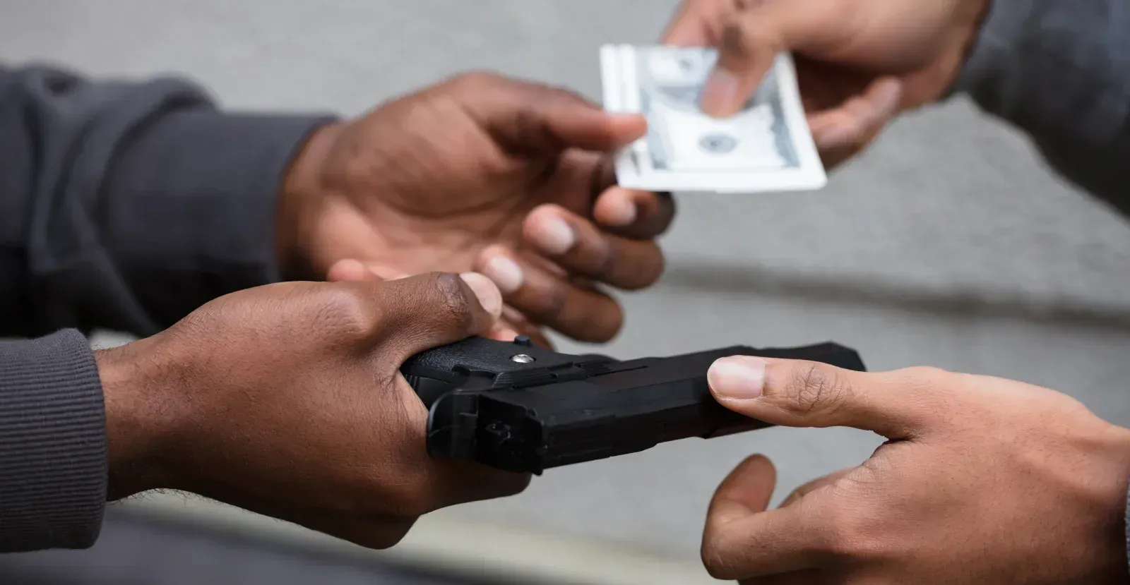 Person buying a gun with cash