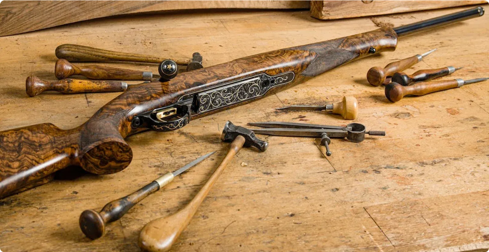 gun with tools on work bench