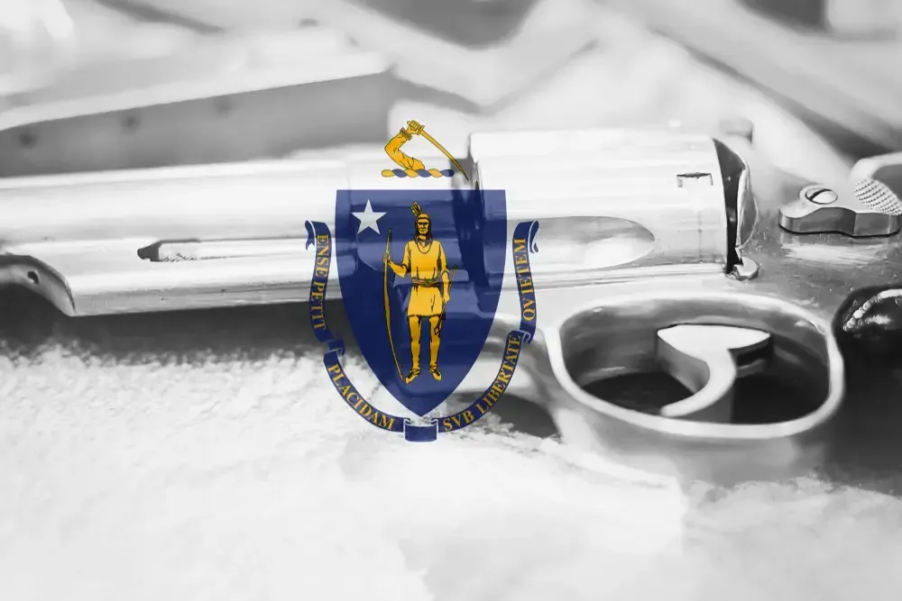 Massachusetts flag on top of a revolver