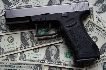 A Glock laying on some cash