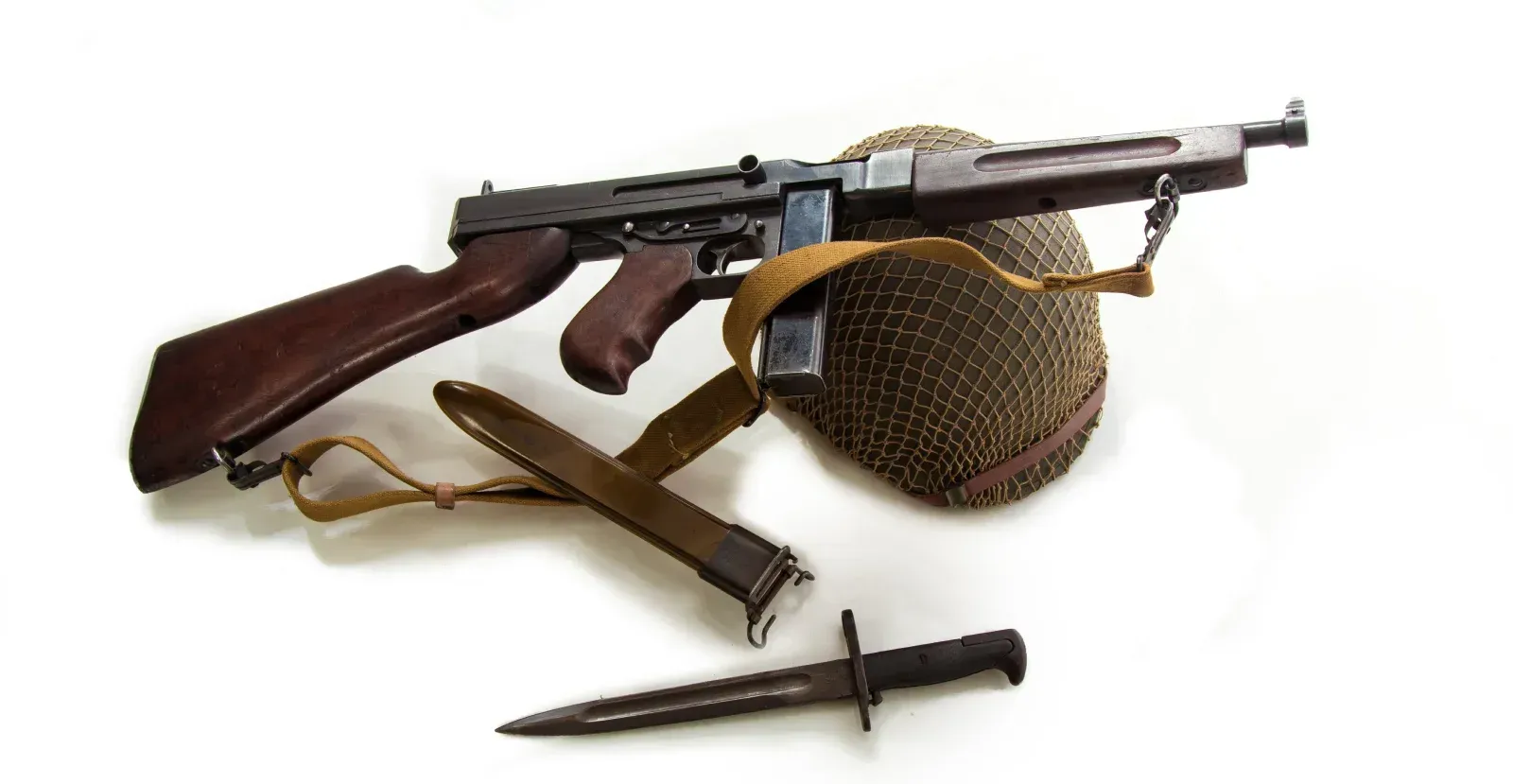 Thompson submachine with helmet and knife