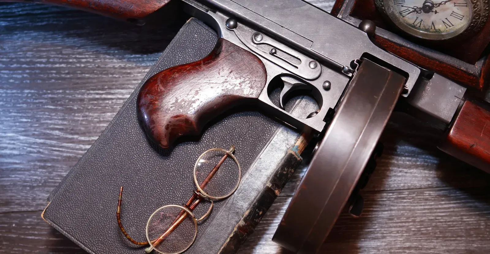 Thompson submachine gun with book and glasses