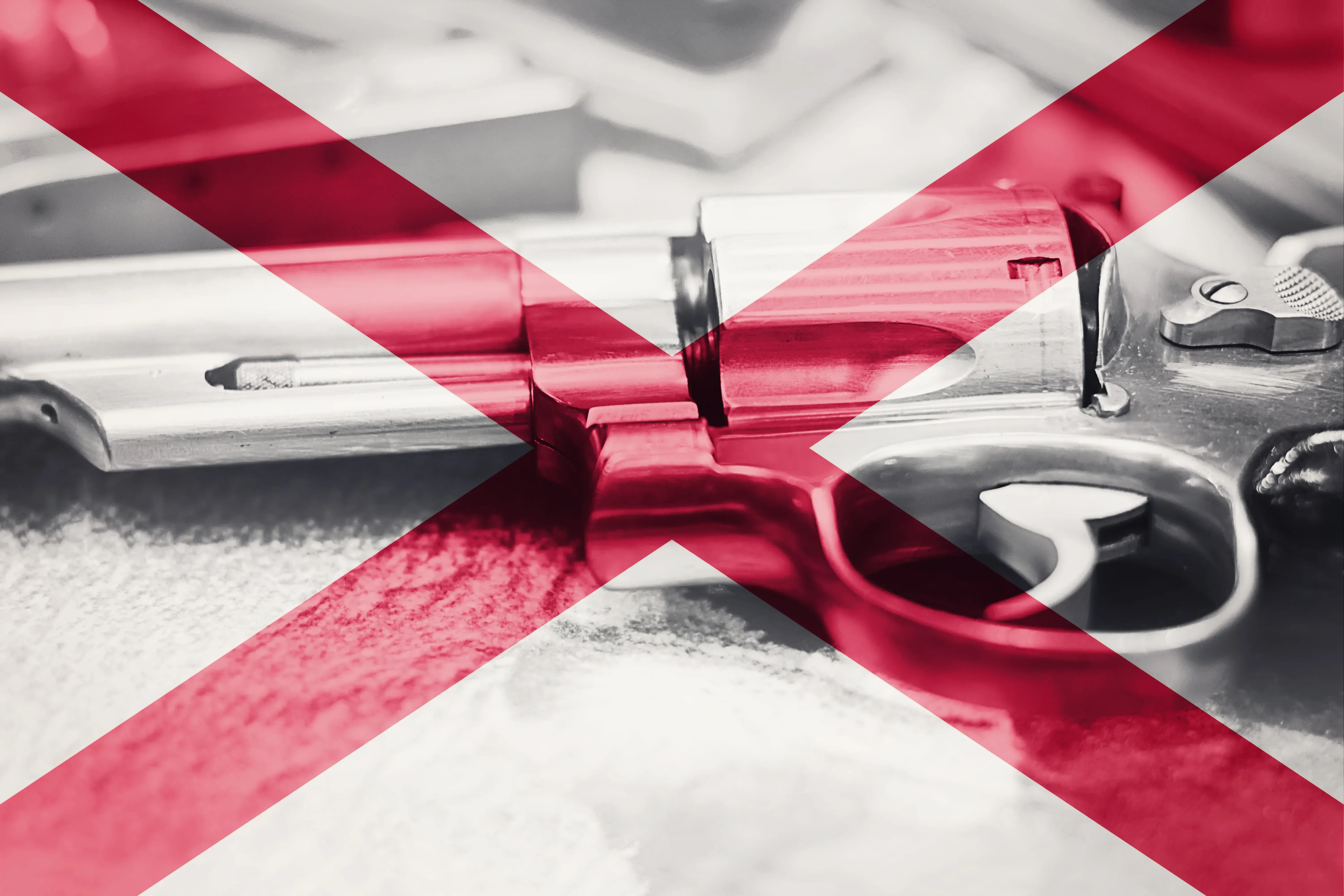 Alabama flag on top of a revolver
