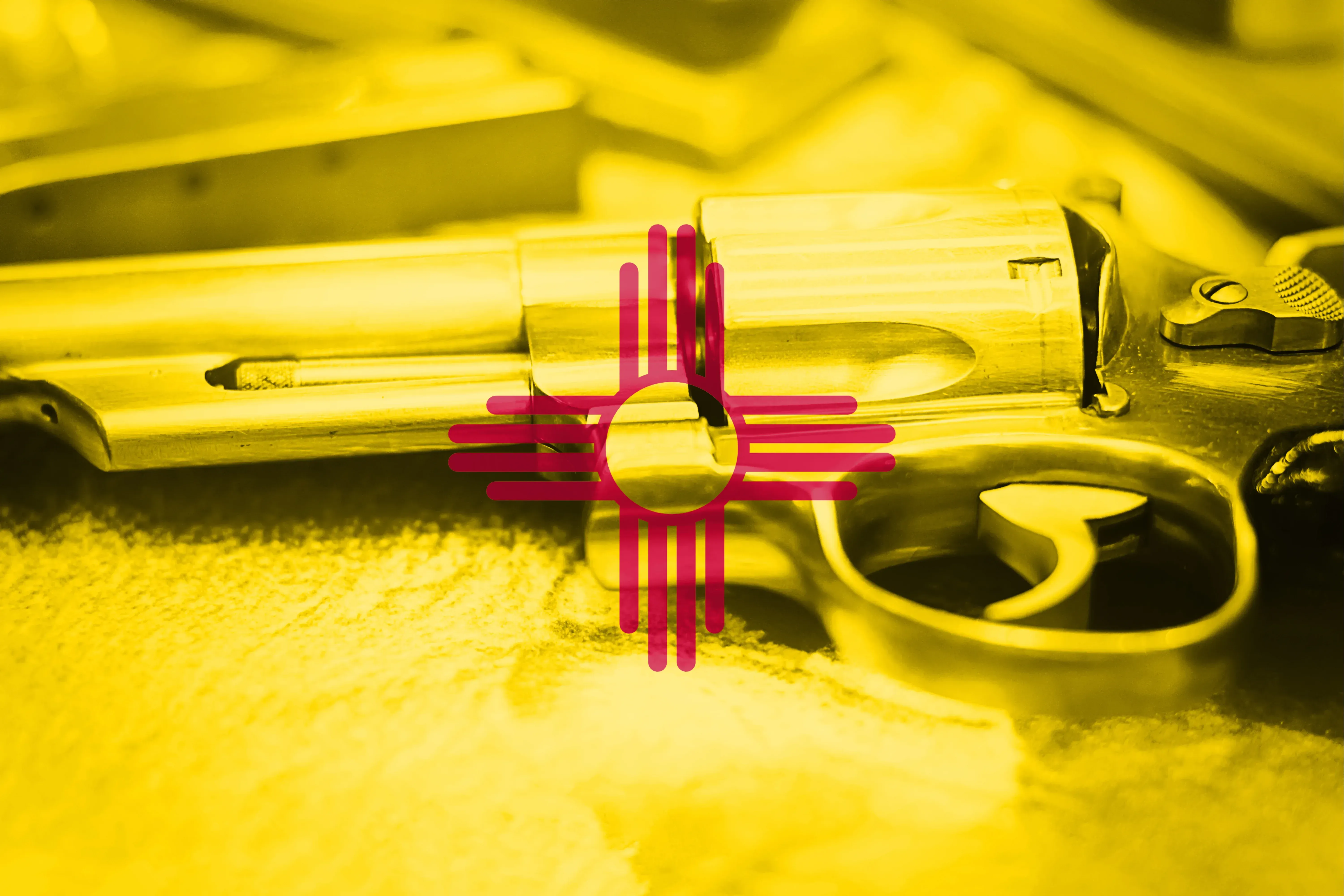 New Mexico flag on top of a revolver