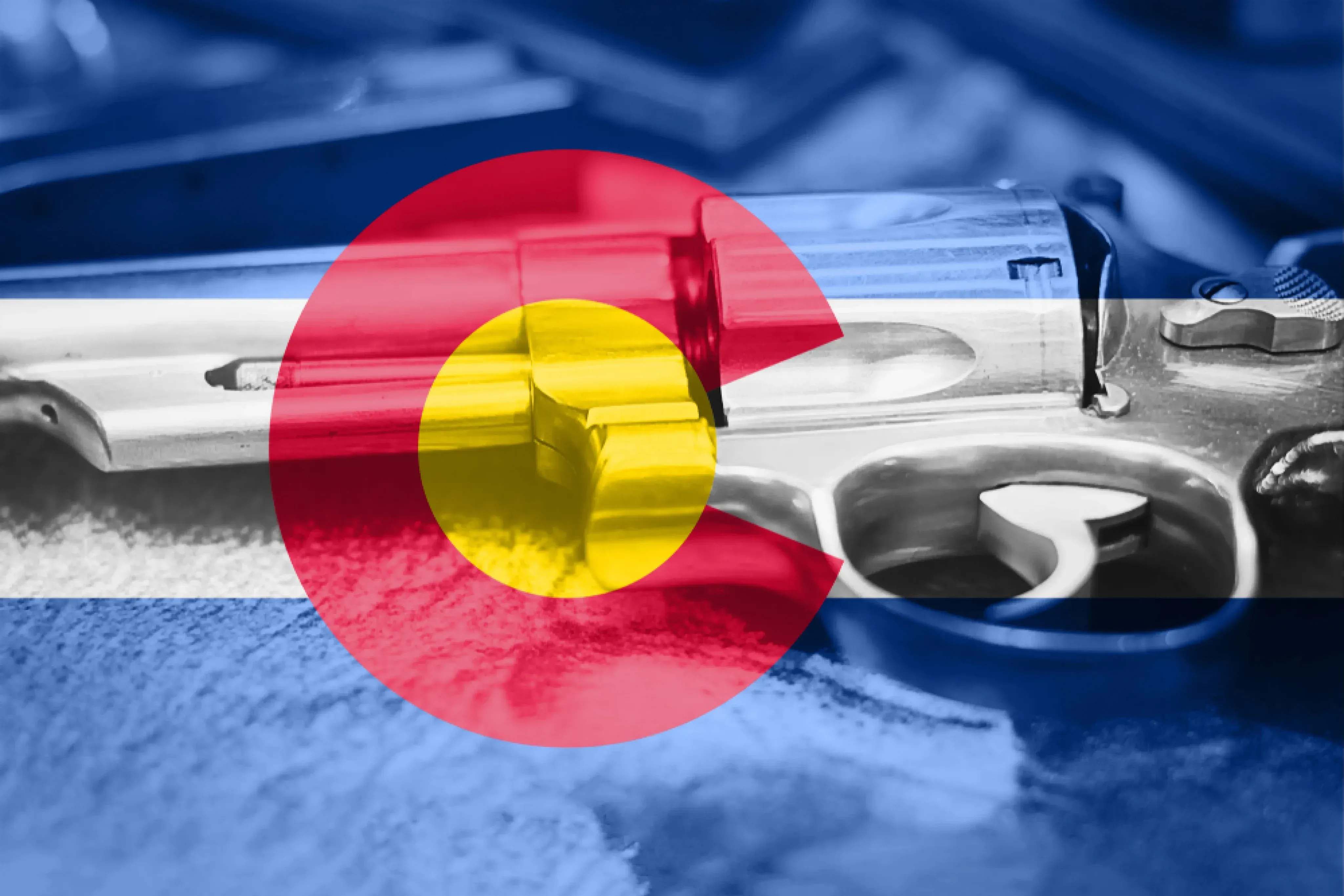 Colorado flag on top of a revolver