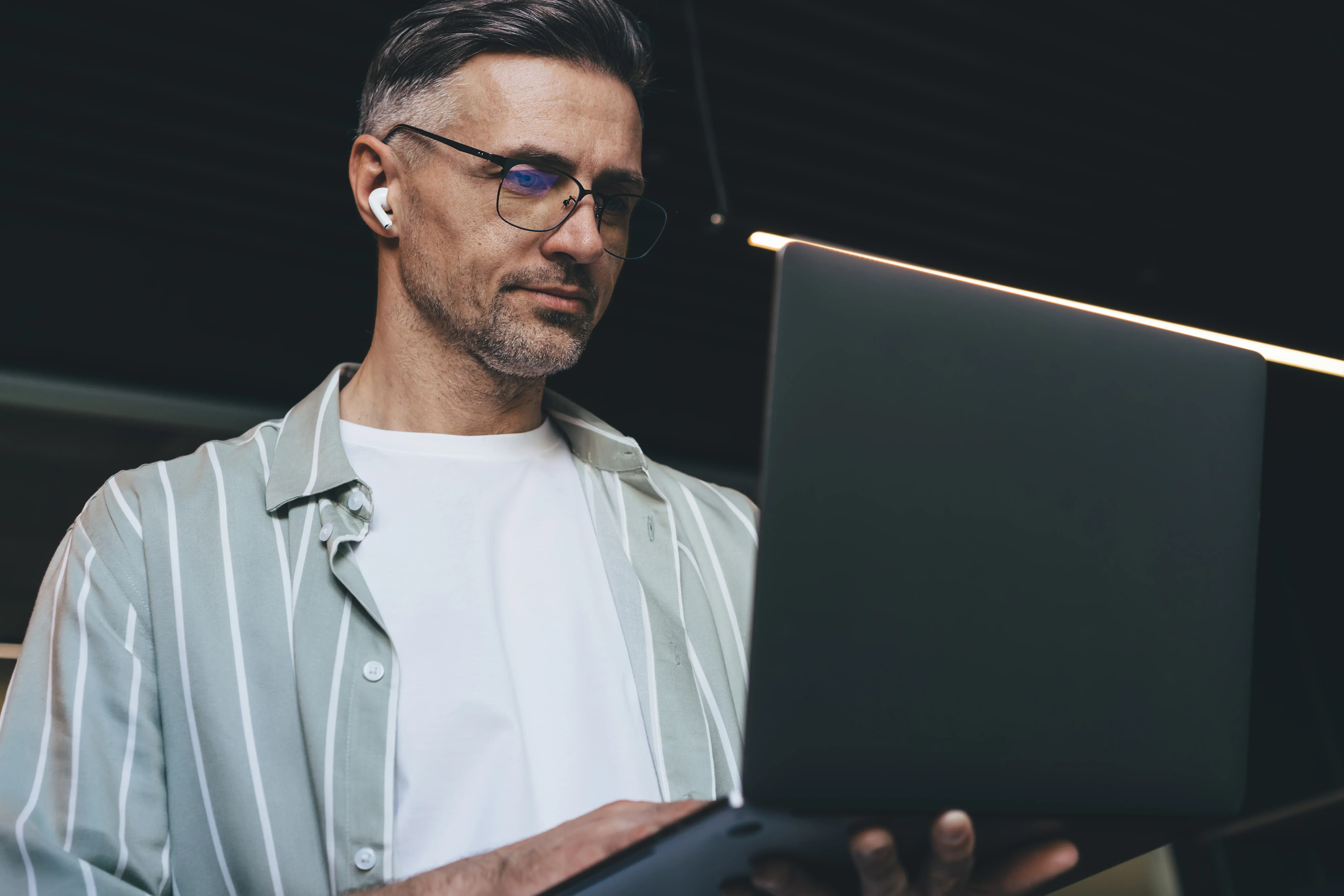 A man verifying something on his laptop