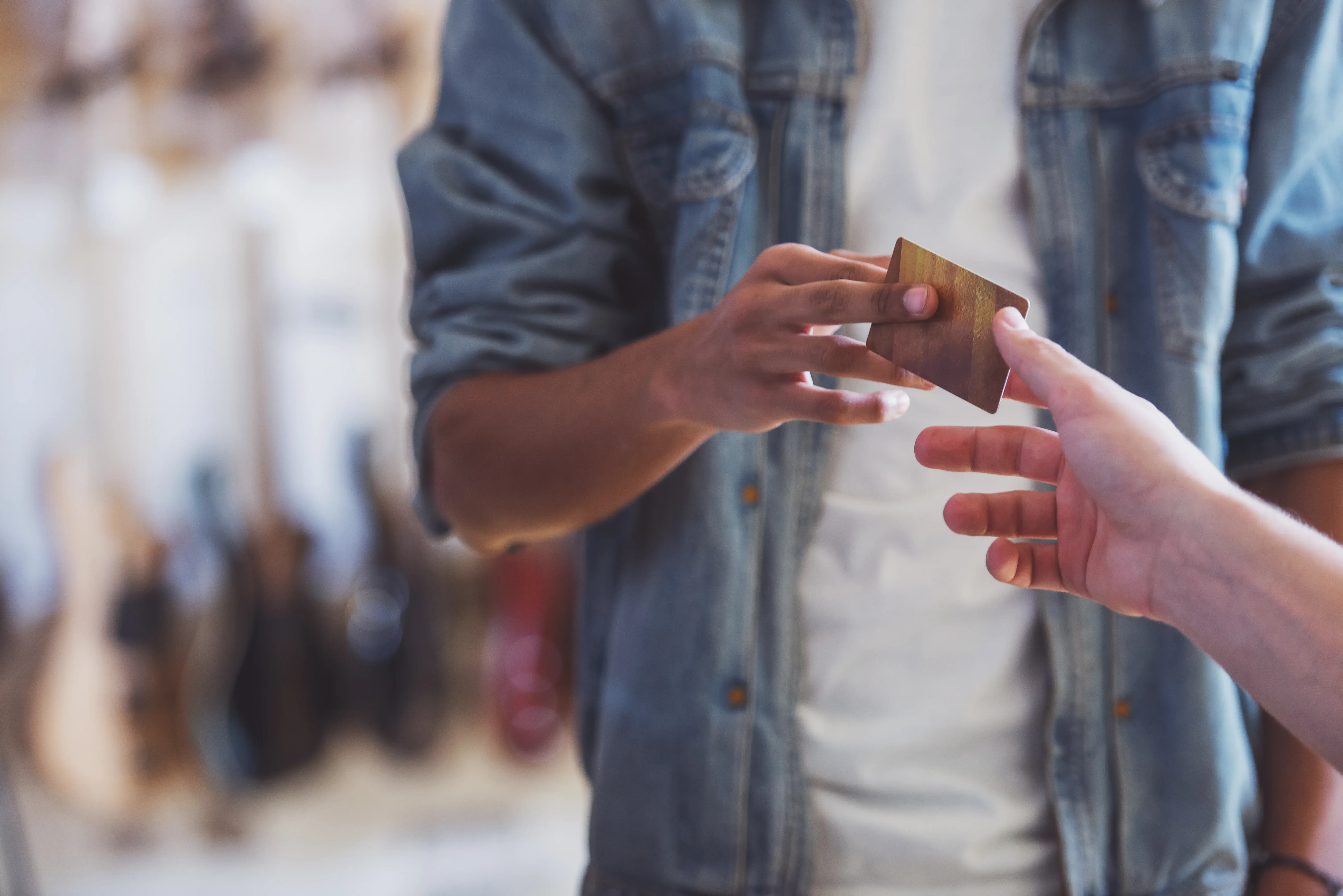 Man handing over an identification card