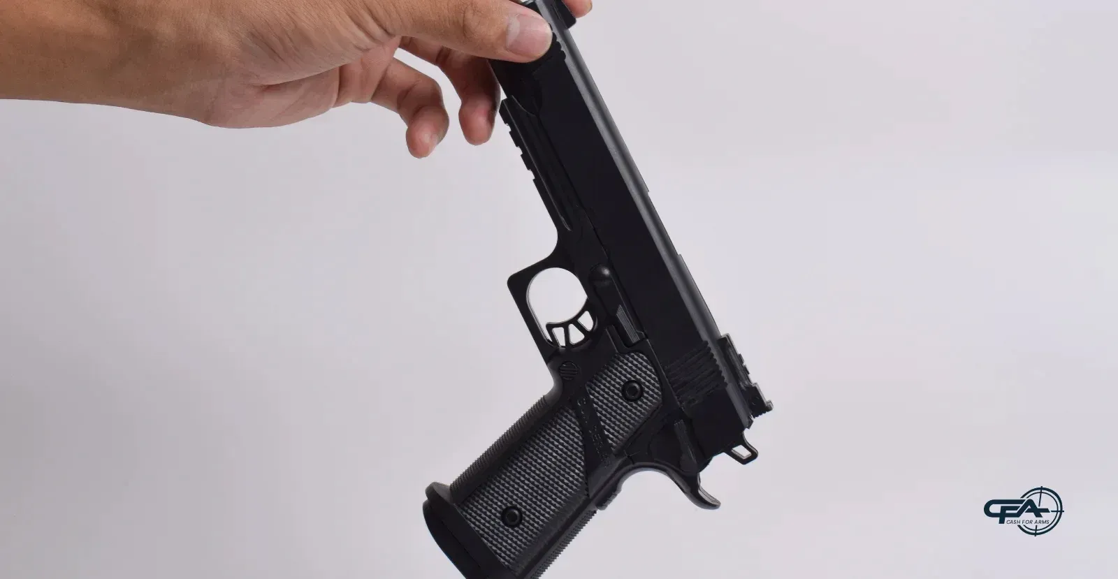 holding handgun