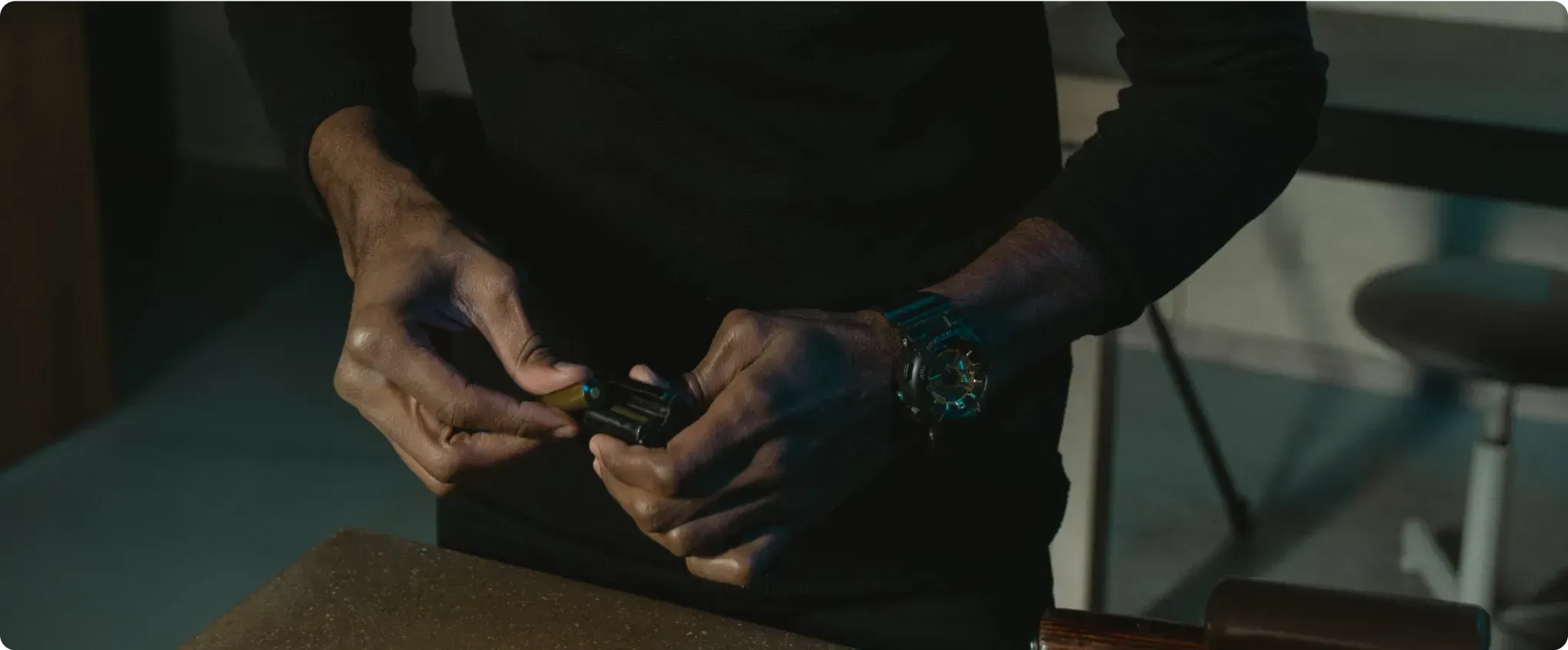 Man's hands loading a handgun magazine — RODNAE Productions